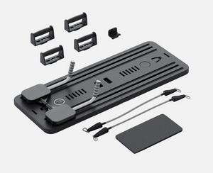 Black reformer Pilates machine complete set with resistance bands and accessories for strength and flexibility training.