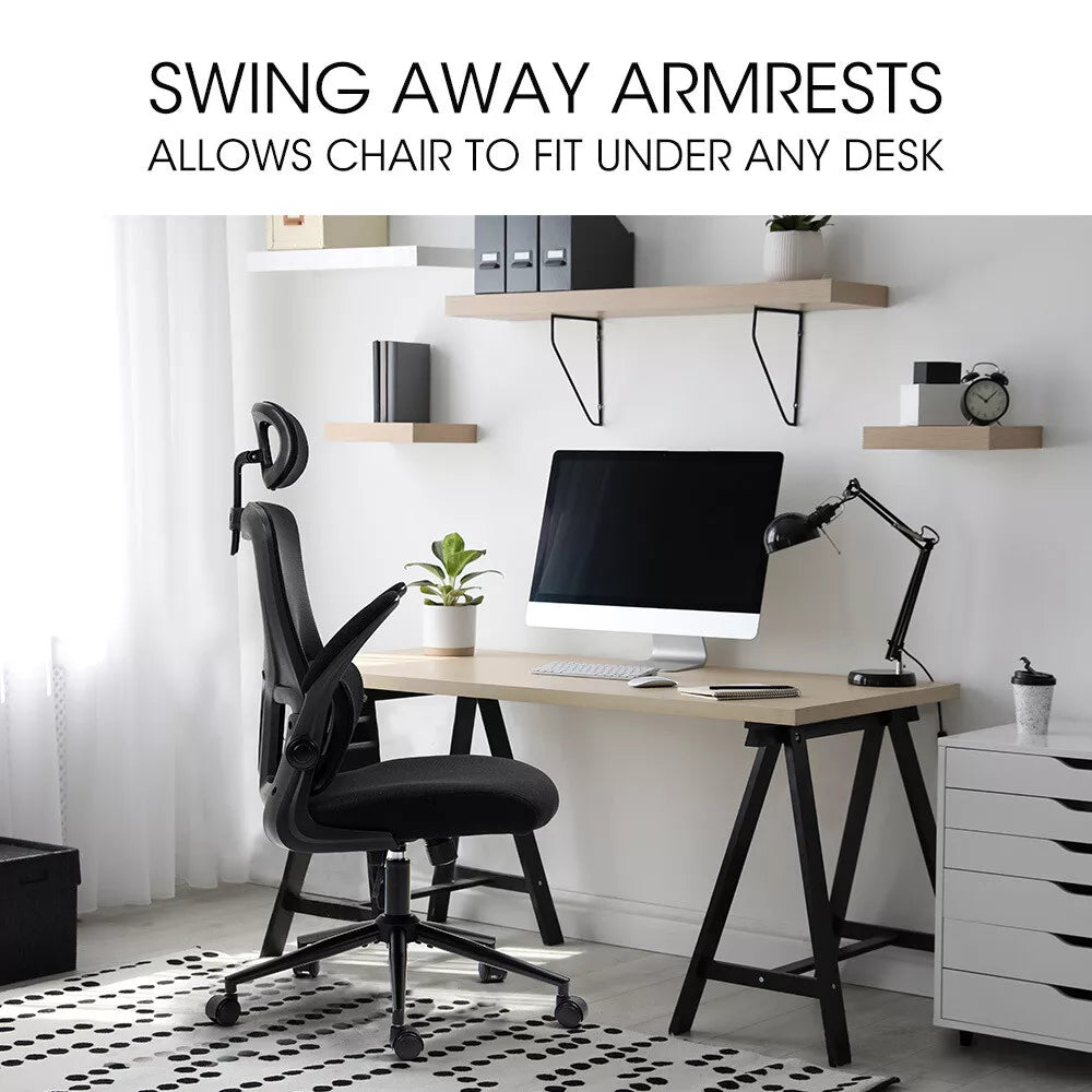 Ergonomic office chair with swing-away armrests at a modern desk setup, ideal for flexible workspace comfort and support