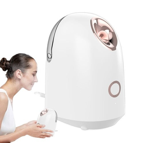 Model using a facial steamer for skincare, demonstrating hydrating warm mist for clearer, healthier-looking skin.