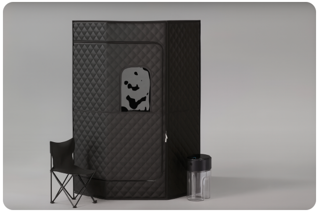 Black portable sauna tent with quilted design, folding chair, and steam generator, ideal for home wellness and relaxation.