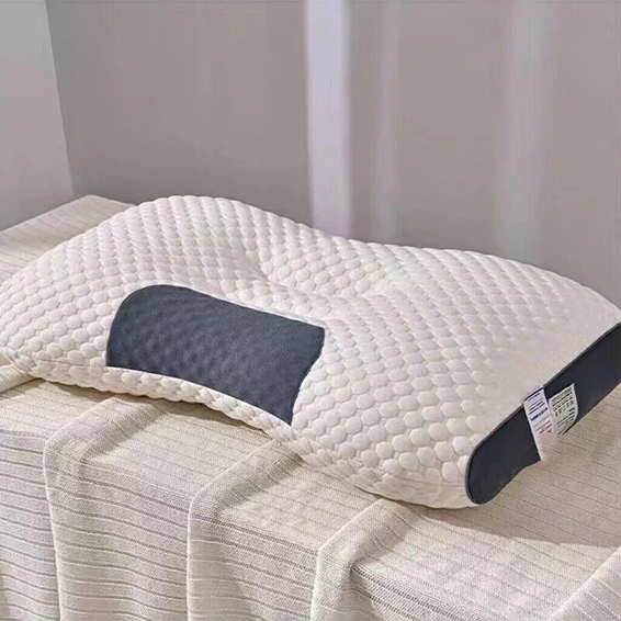 Terra Wellness Ergonomic Pillow 2.0 designed for neck pain relief and spinal alignment on a neutral bedding setup