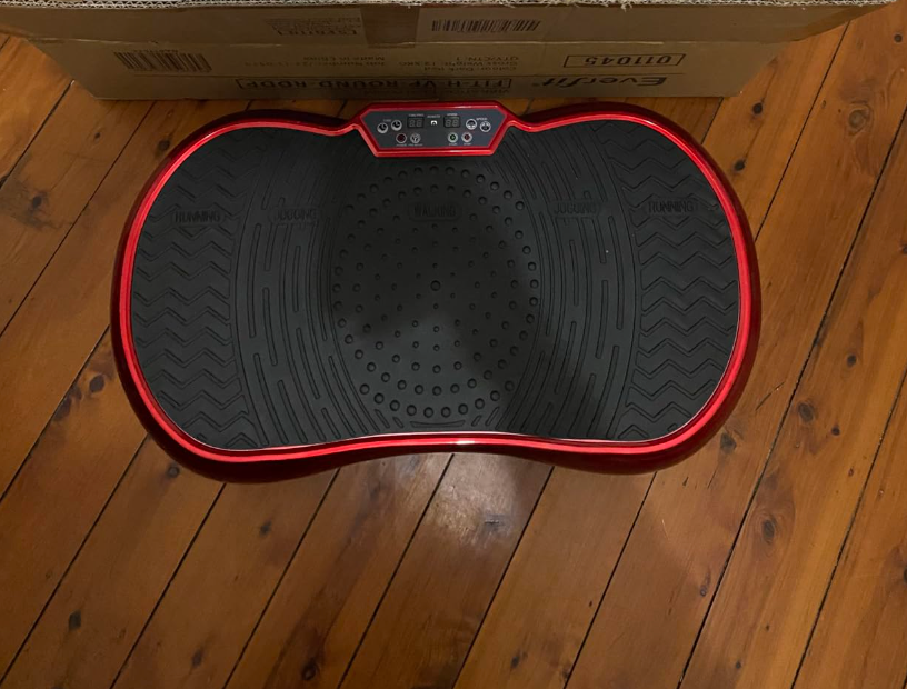 Soft-lit bedroom scene showing Terra Wellness Ergonomic Pillow used for neck and spine alignment