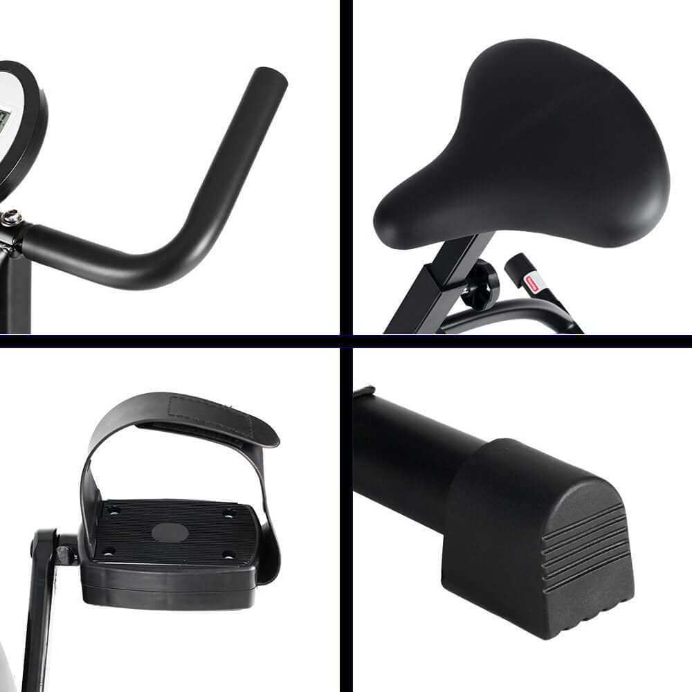 Close-up of foldable exercise bike features, including handlebars, cushioned seat, adjustable pedals, and sturdy frame for a comfortable workout experience."