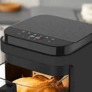 Close-up of a black glass air fryer with a digital control panel, cooking golden-brown toast for healthier, oil-free meal preparation.