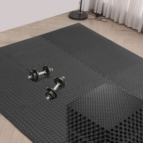 Premium black gym mats laid out on floor for home or commercial fitness setup