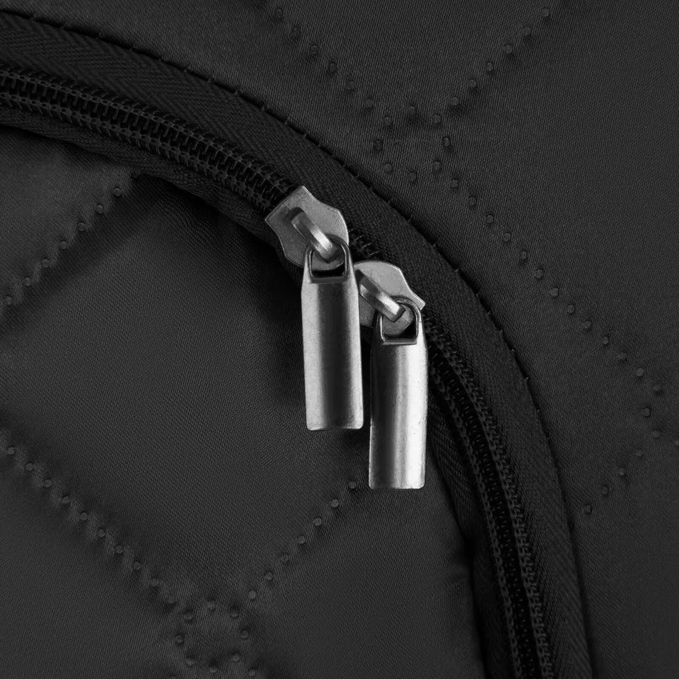  "Close-up of dual zippers on the front opening of a black sauna tent, attached to quilted insulated fabric. Highlights smooth zipper functionality and durable construction for easy entry and secure closure.